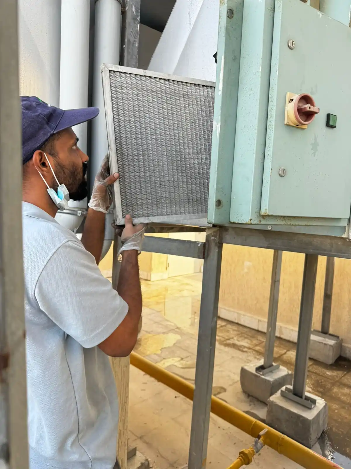 Technician cleaning an air duct system — supporting project view 1