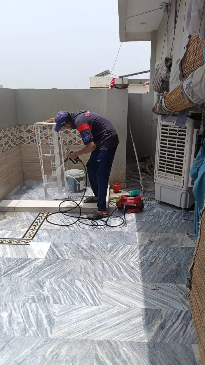 Technician servicing a wall-mounted split AC inside a Dubai home — supporting project view 3