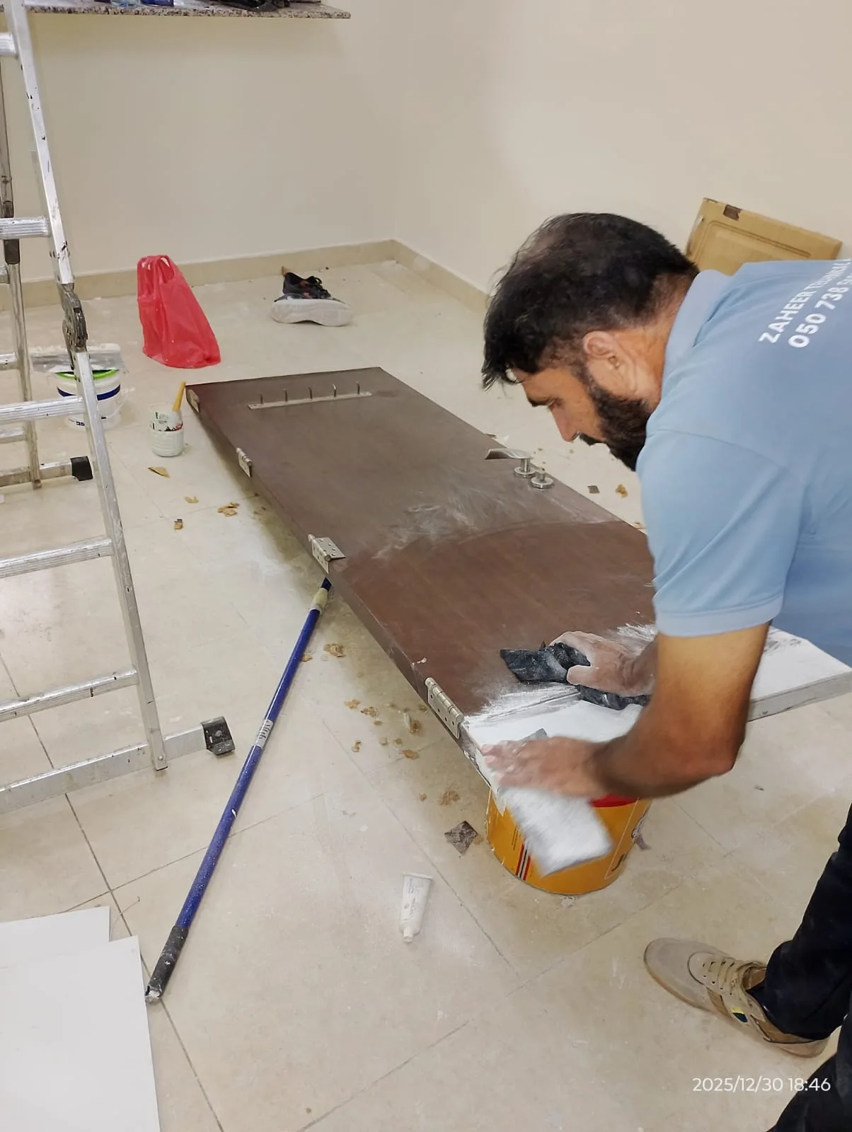 Carpenter working on wooden panels in a Dubai workshop — supporting project view 1