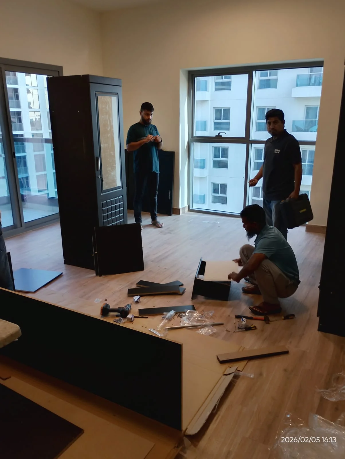 Carpenter working on wooden panels in a Dubai workshop — supporting project view 2
