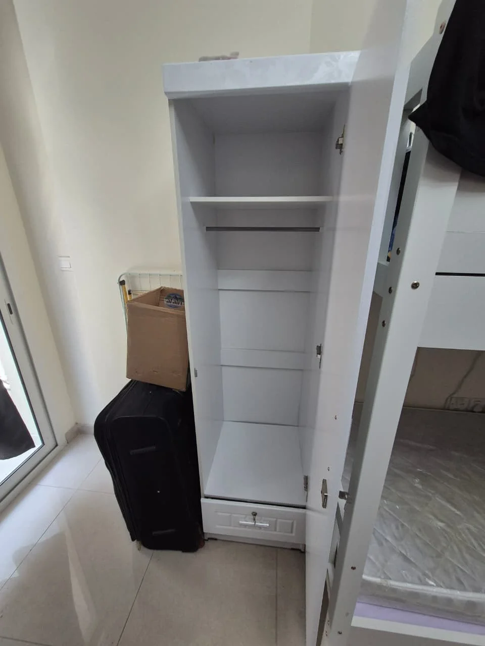 Technicians assembling a wardrobe inside a Dubai home — supporting project view 3