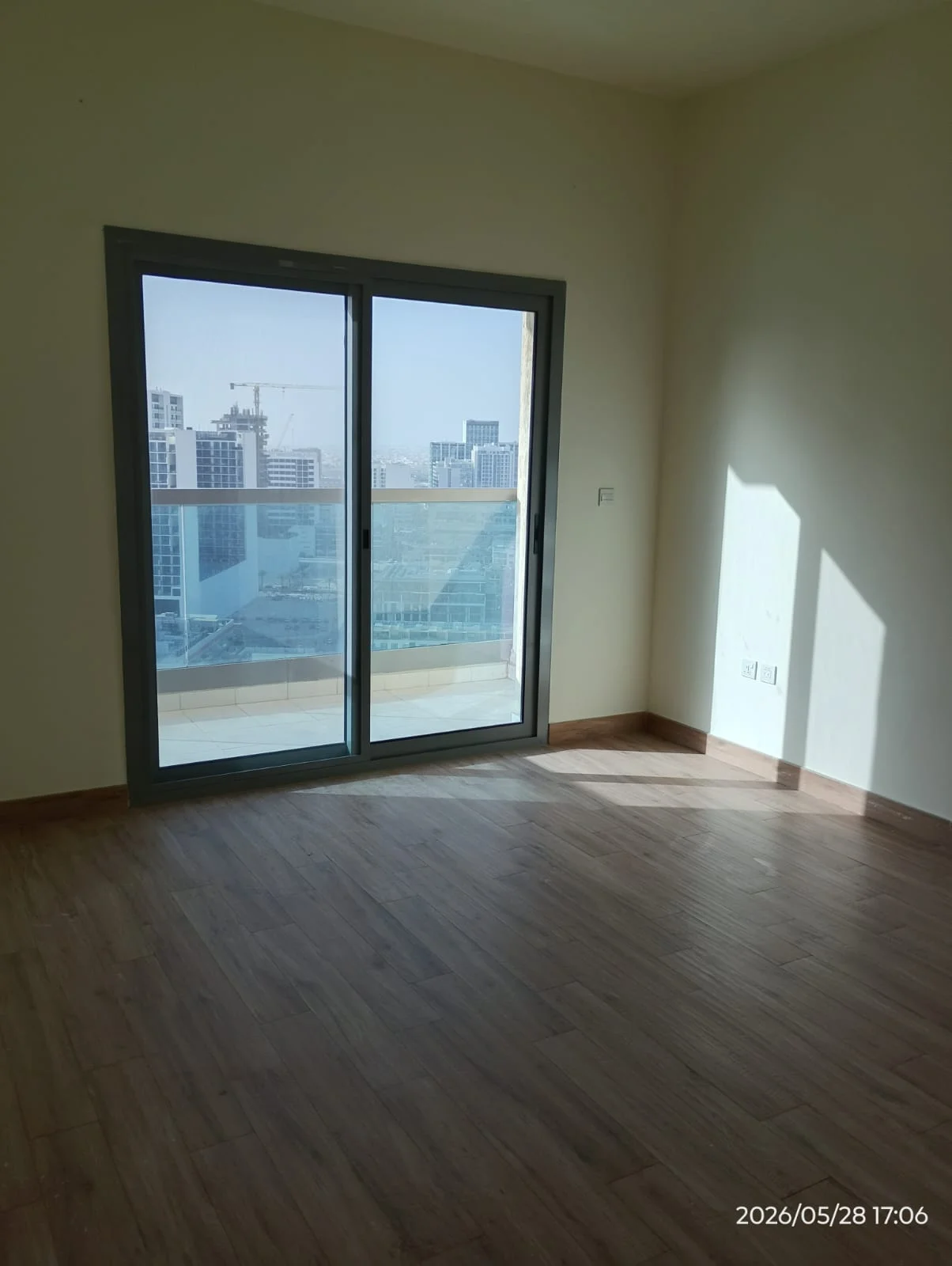 Cleaner washing a large apartment window in Dubai — supporting project view 3