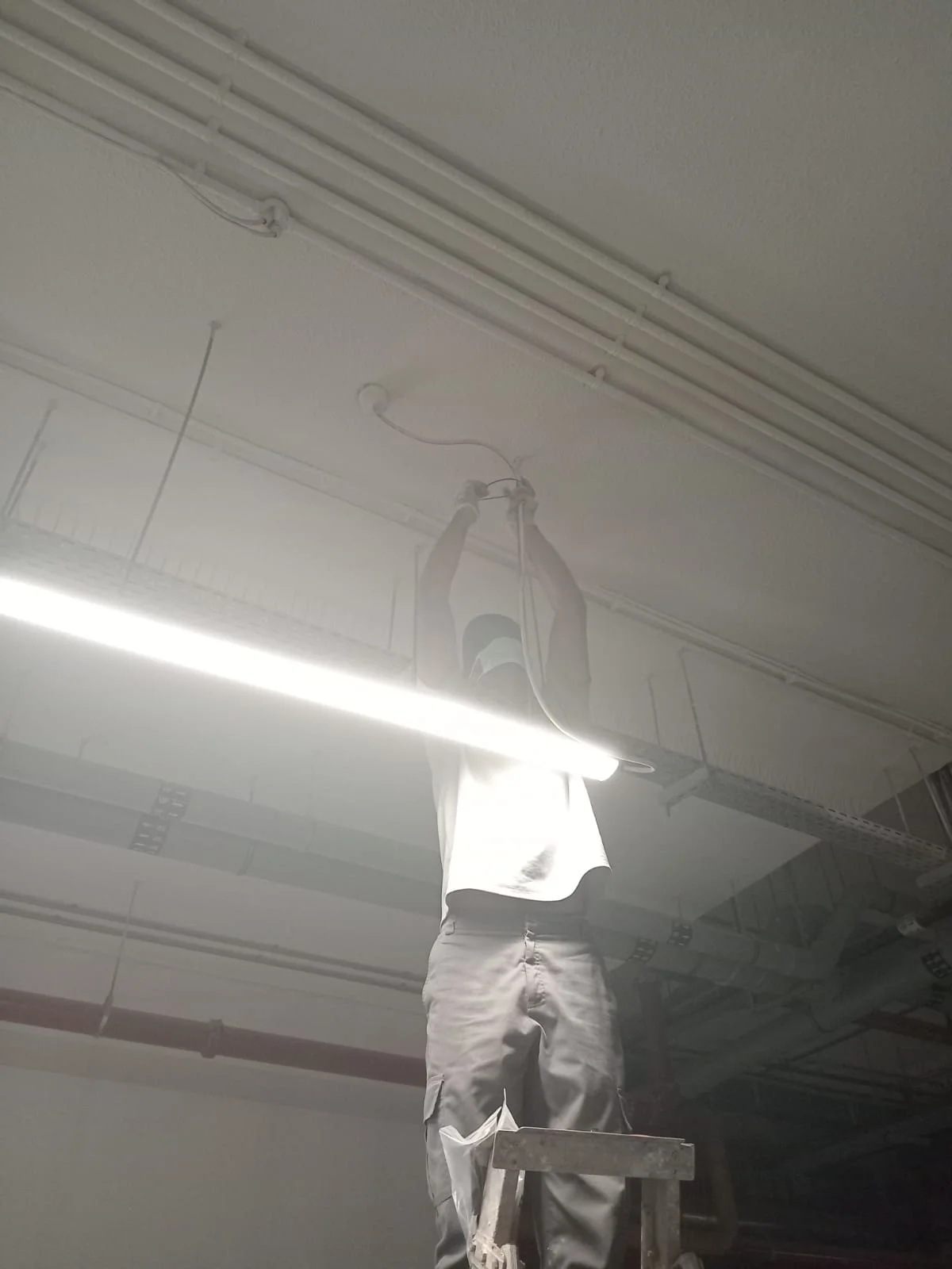 Technician carrying out electrical panel repair work in Dubai — supporting project view 1