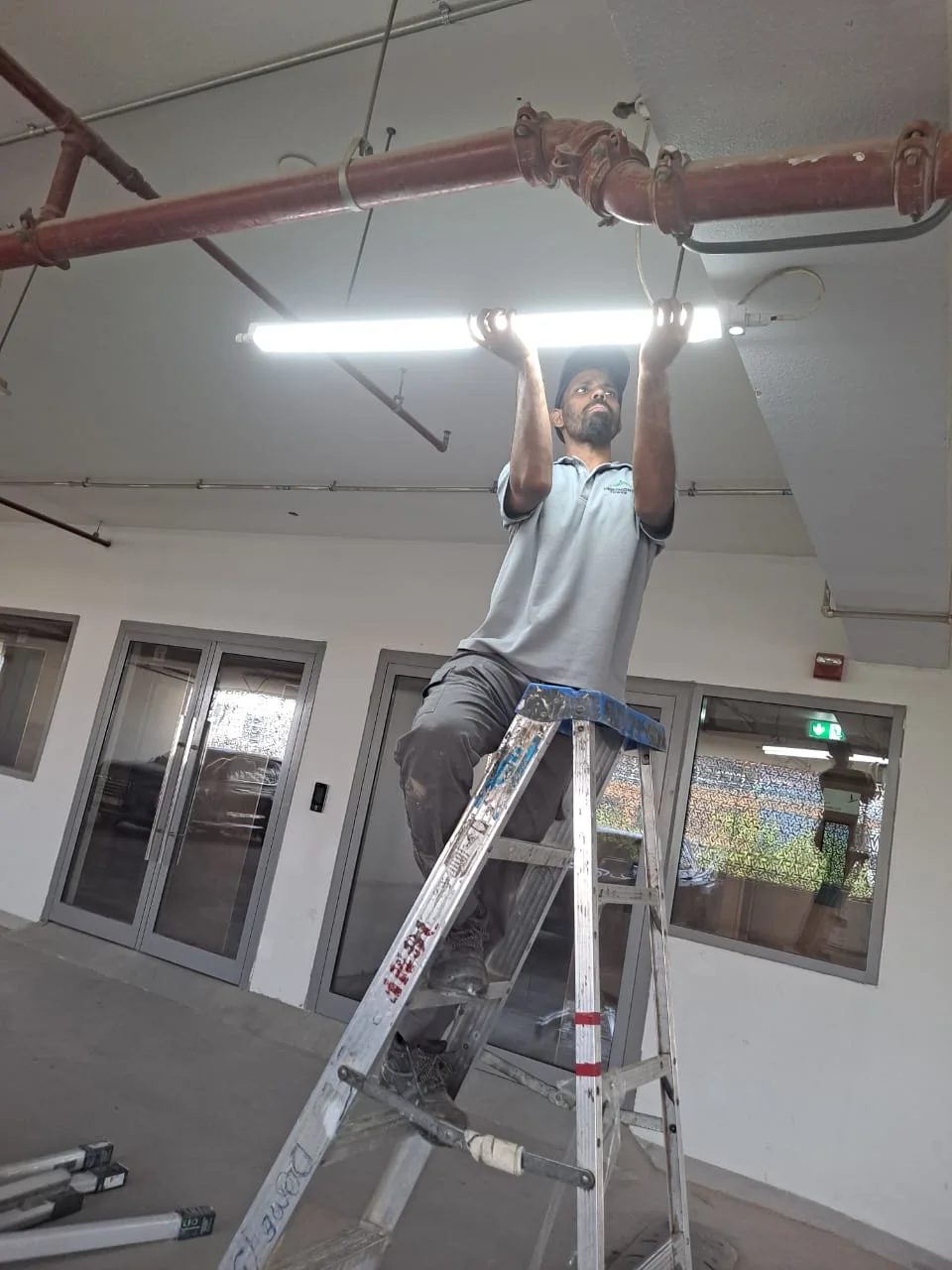 Technician working on an electrical panel in Dubai — supporting project view 1