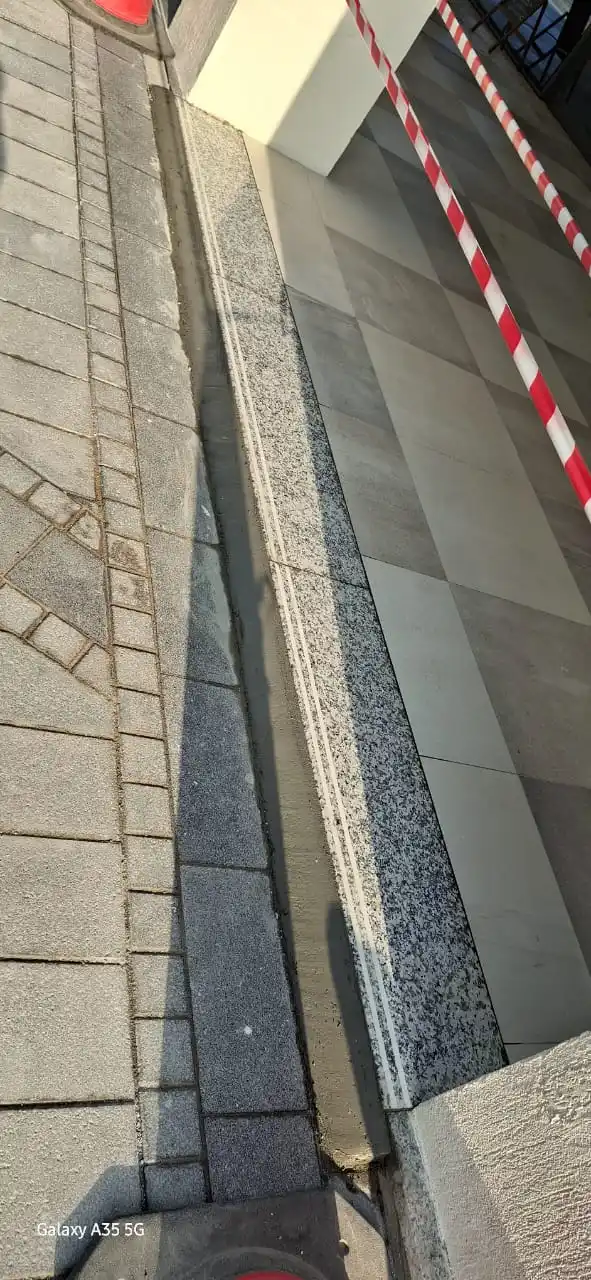 Technician installing tile pieces on a surface in Dubai — supporting project view 2