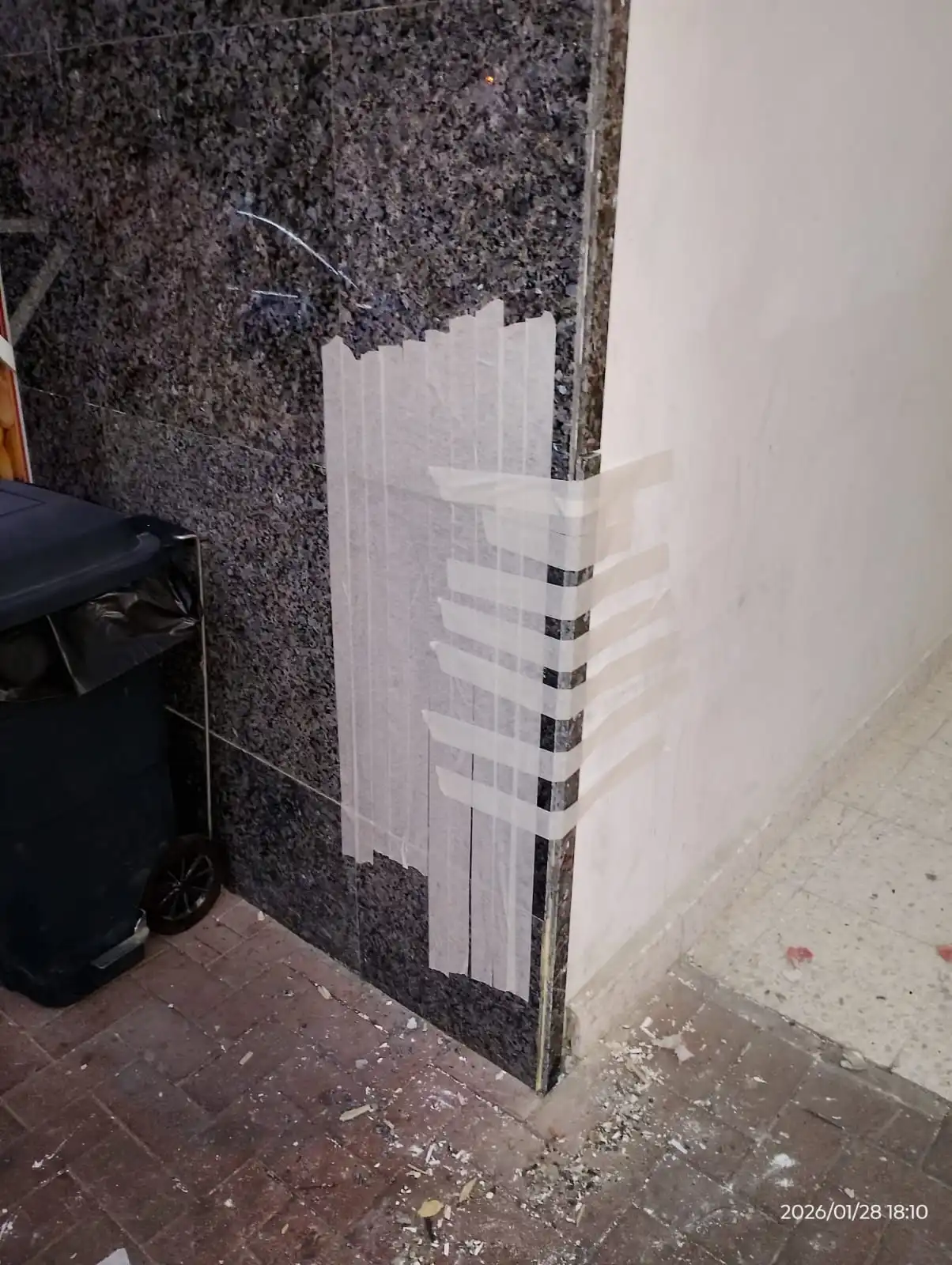 Technician installing tile pieces on a surface in Dubai — supporting project view 1
