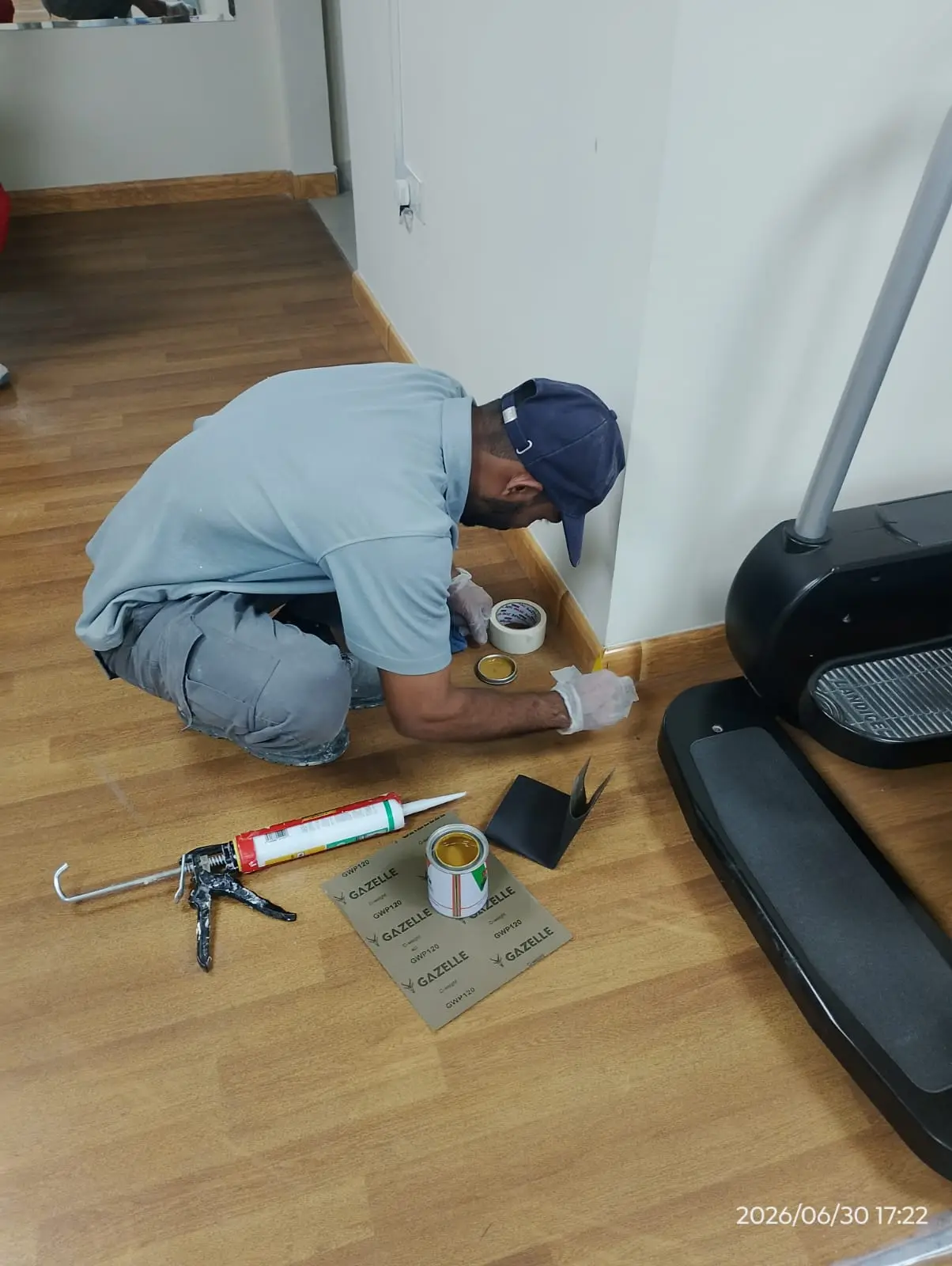 Technician repairing floor tiles in a Dubai property — supporting project view 2