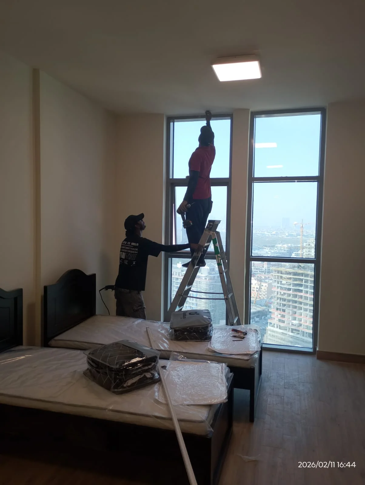 Handyman repairing a wall surface inside a Dubai home — supporting project view 2