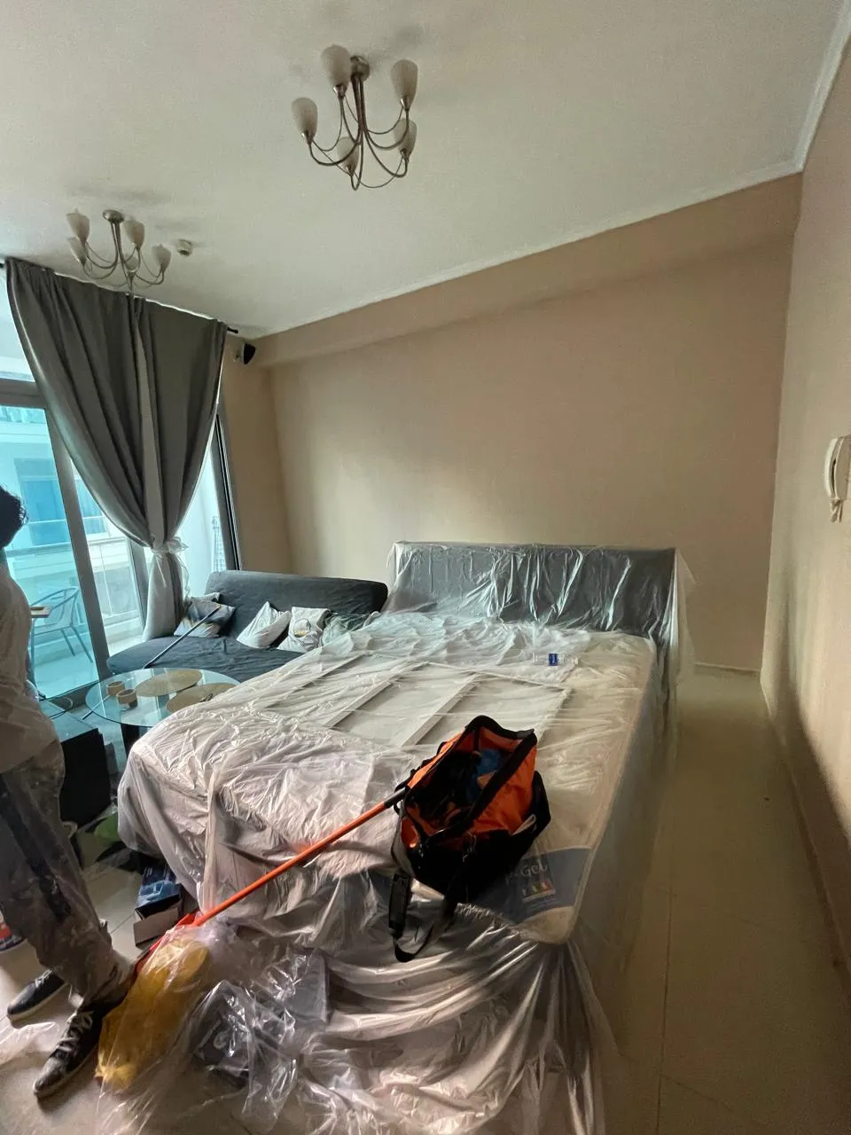 Painter applying wall paint in a Dubai apartment bedroom — supporting project view 2