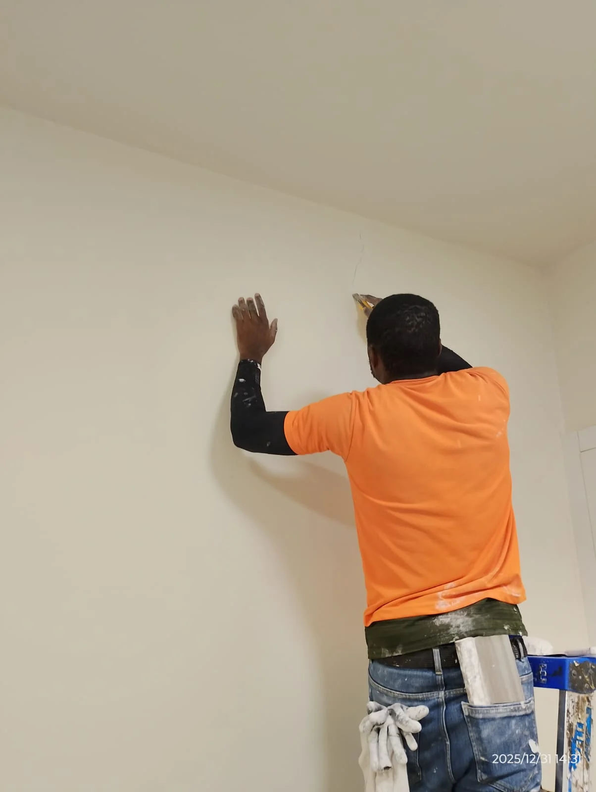 Painters applying wall paint inside a Dubai property — supporting project view 1