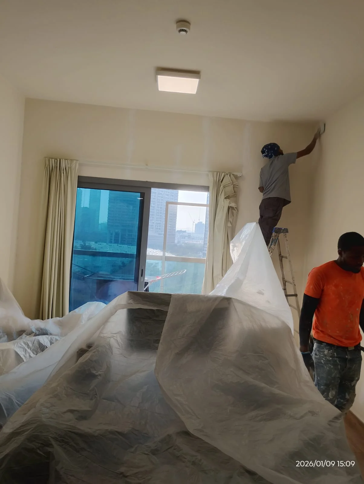 Painters applying wall paint inside a Dubai property — supporting project view 2