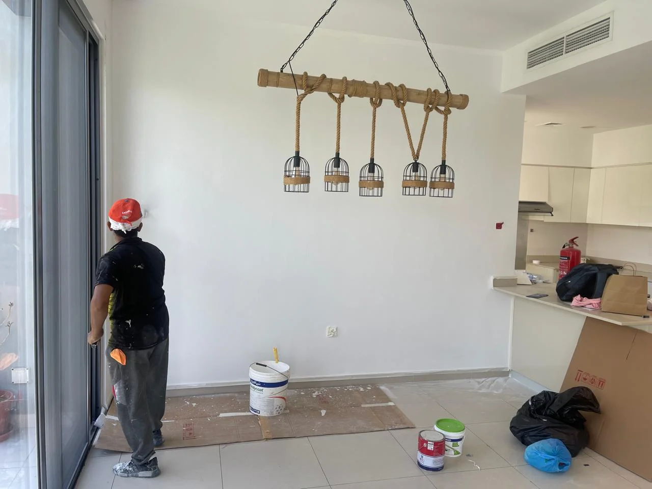 Painter working inside a villa living area in Dubai — supporting project view 2