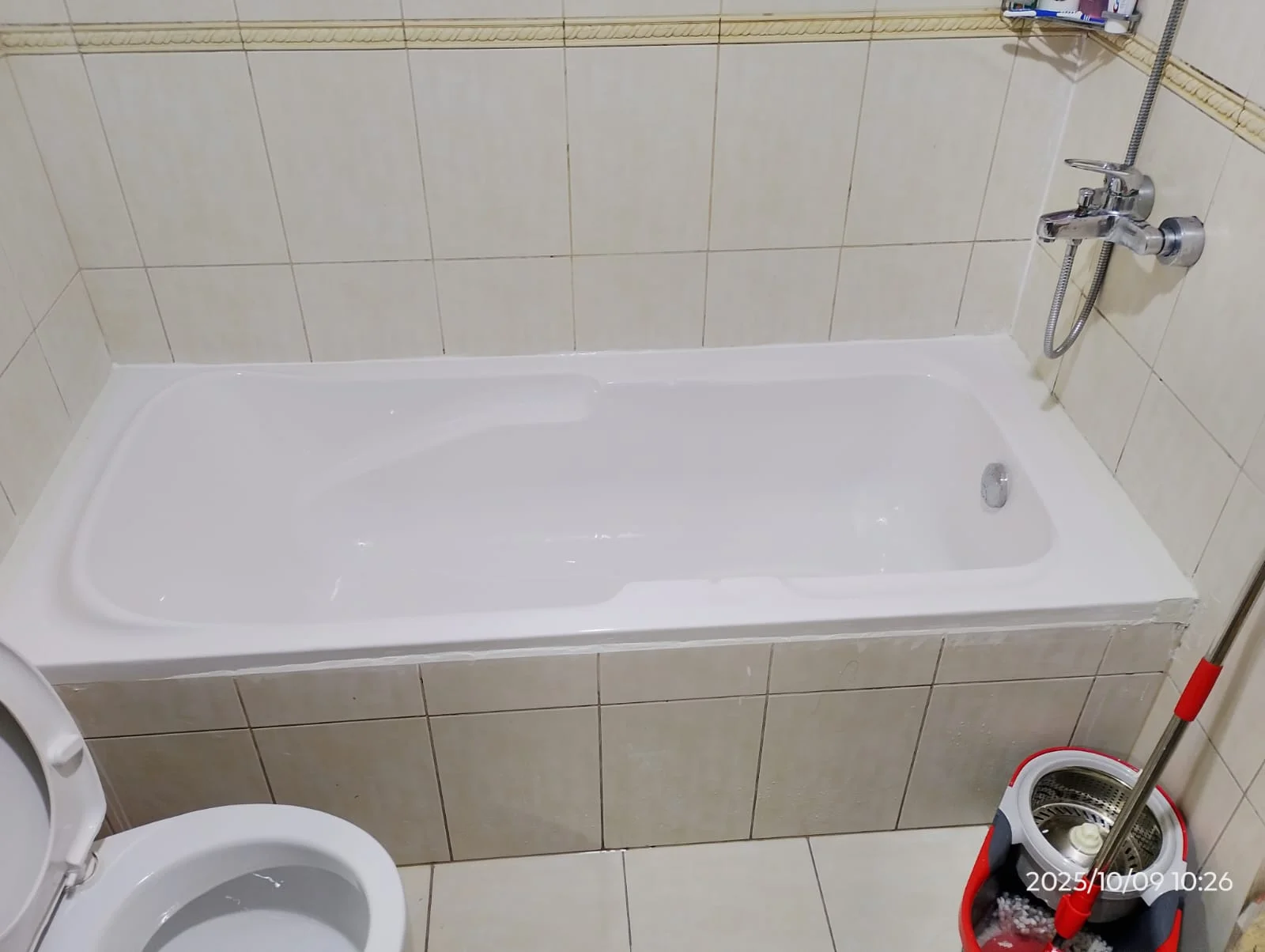 Technician carrying out bathroom plumbing work beside a toilet in Dubai — supporting project view 3