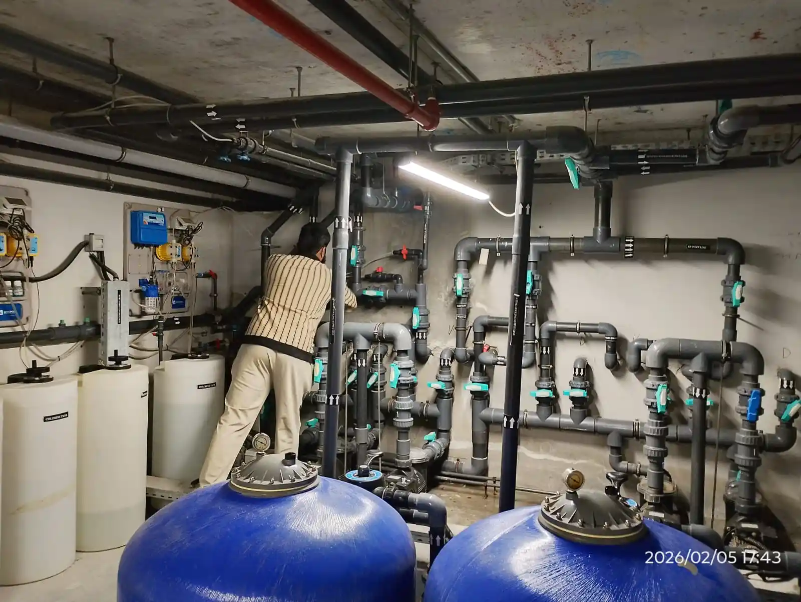 Technician carrying out pool maintenance at a Dubai property — supporting project view 1