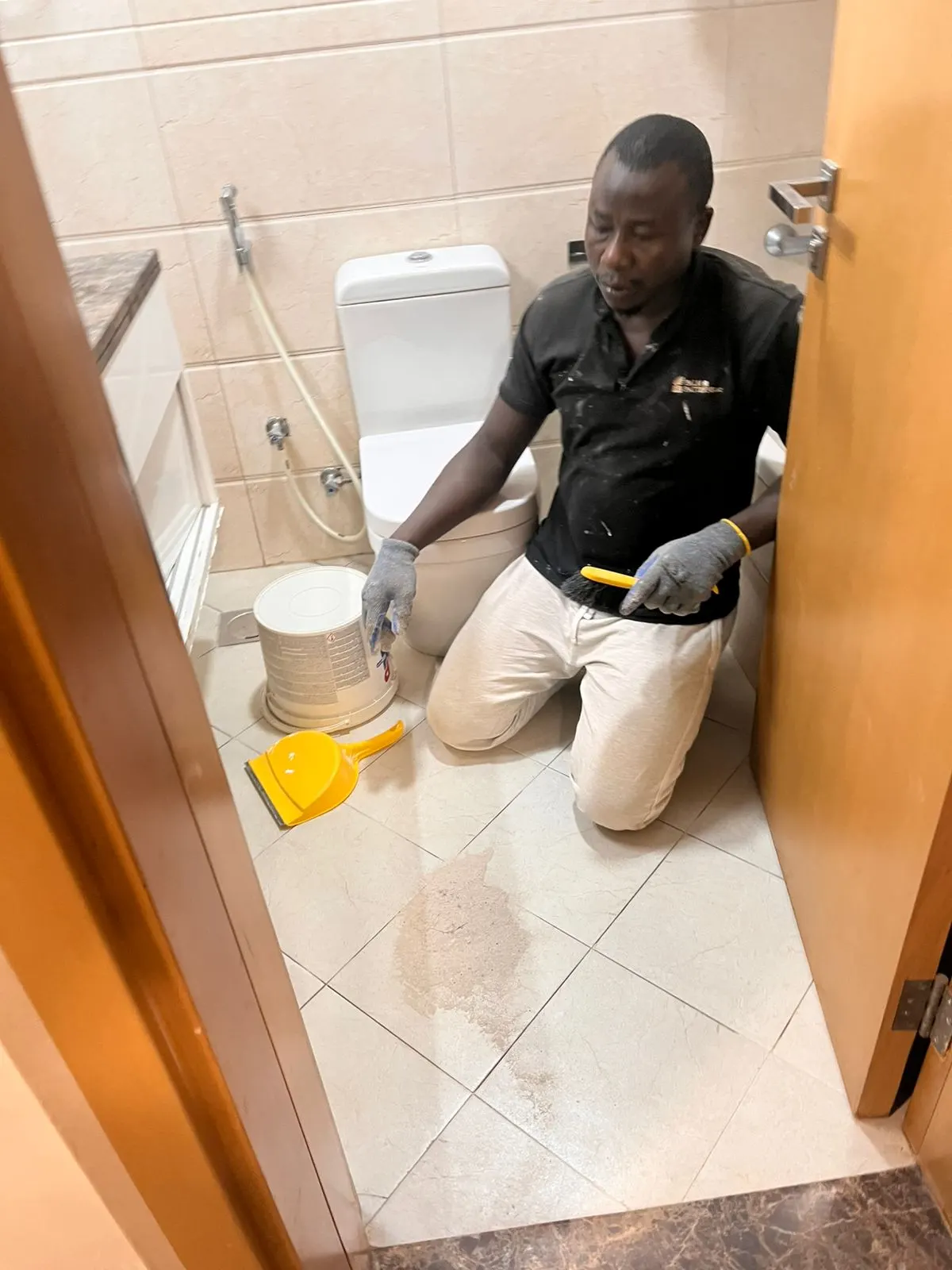 Technician applying waterproofing material along an exposed surface in Dubai — supporting project view 3
