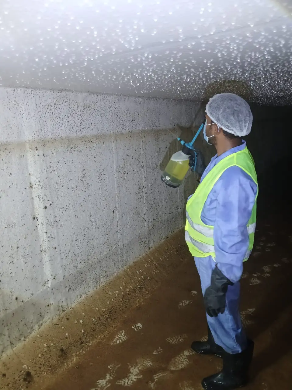 Cleaning team working inside a large water tank in Dubai — supporting project view 2
