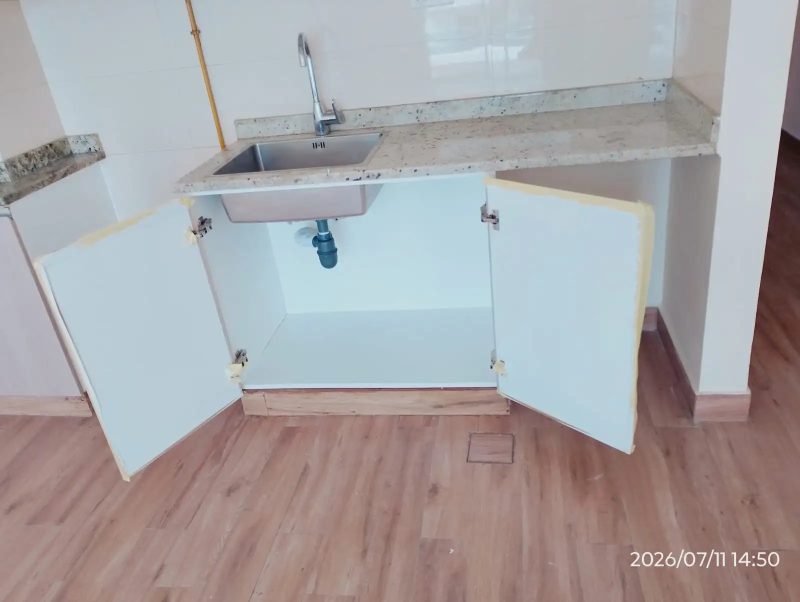 Kitchen cabinet repair work at a Dubai property