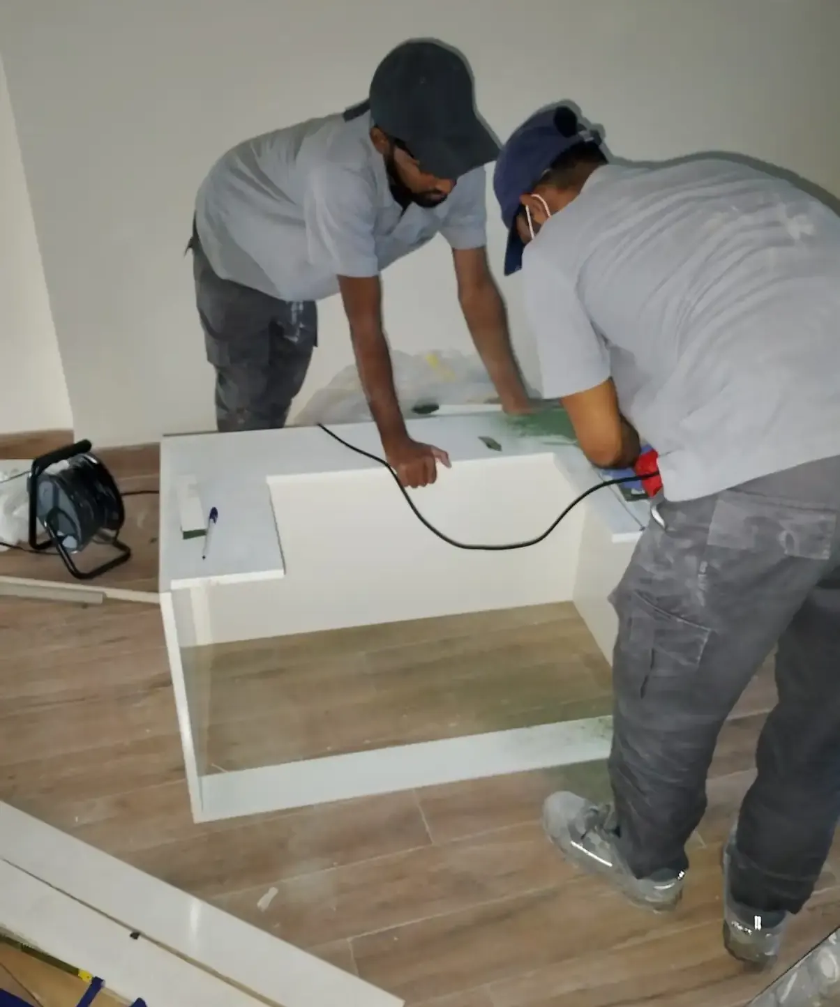 Home maintenance technicians working inside a property in Dubai
